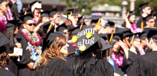 Graduating students walk into their graduation ceremony