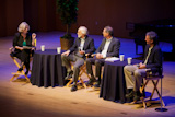 The forum panel: Moira Gunn (moderator), J. Michael Bishop, Arthur Levinson, and David Haussler.