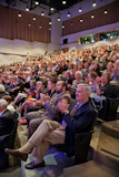 A sold-out audience enjoying the lecture.